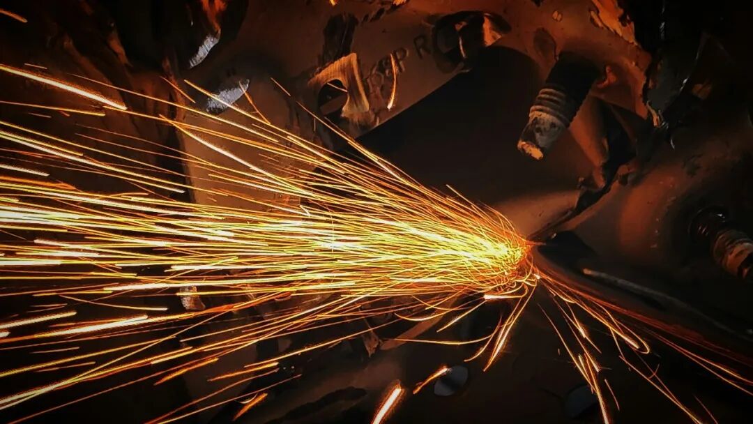 Sparks fly during metal welding or cutting